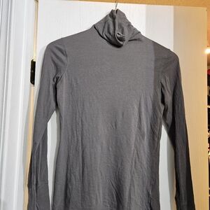 Women's gray loose turtleneck top. Long sleeve